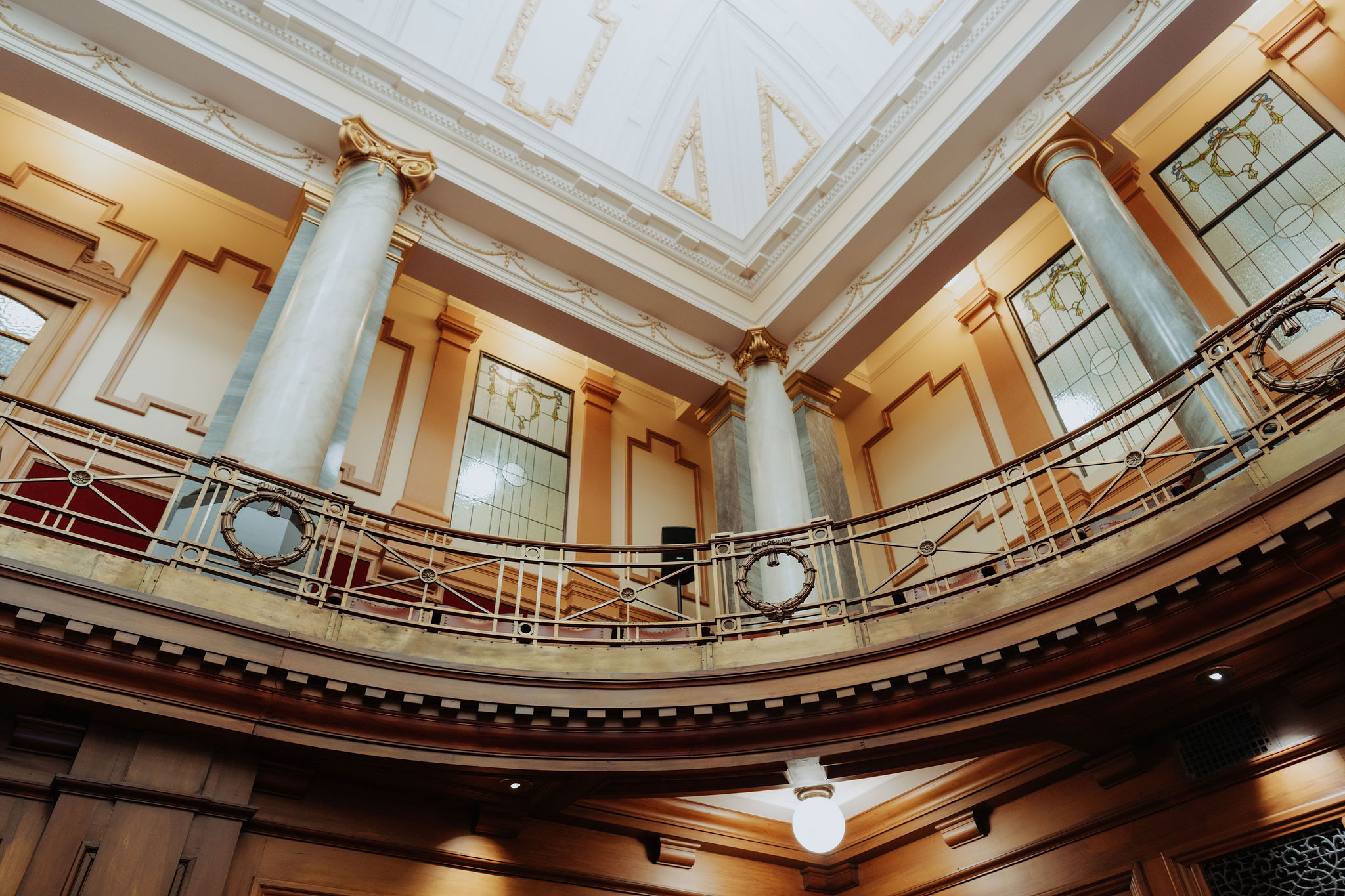 photo of Leglislative Council Chamber showing ornate architecture on balcony level