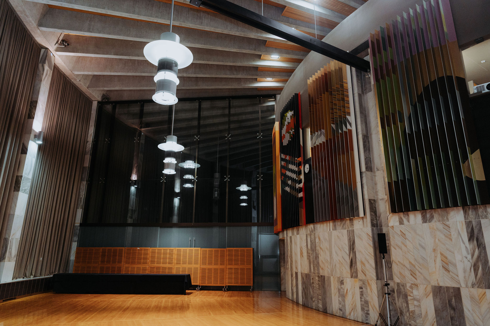 photo showing large pendulum lights inside large hall space